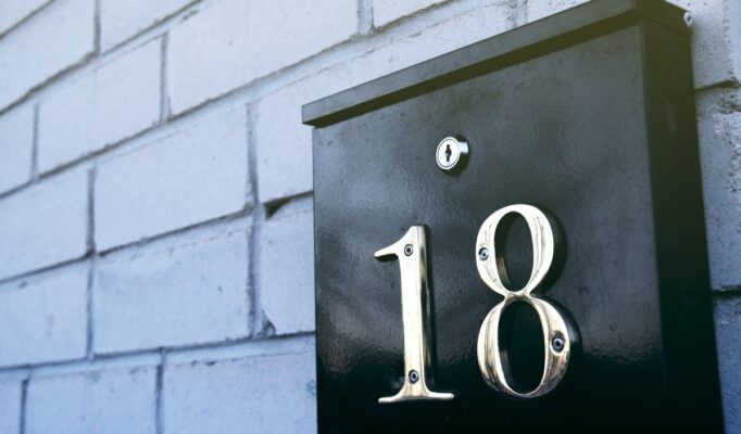 Black mailbox on wall